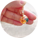 ハーバリウムピアス／イヤリング オレンジ系花ガラスドーム
