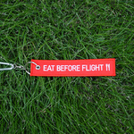 「EAT BEFORE FLIGHT」刺繍タグキーホルダー
