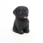 コルクの黒ラブ子犬
