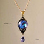 魔法世界への入り口 球体宇宙レジン 色変化雫付きのネックレス
