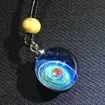 ガラス玉のペンダント　人工ルビー入り