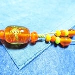 オレンジ色の透明ガラスに金箔を入れた「とんぼ玉」ストラップ　あすなろ M-106