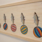 Fish ride on the colourful ball