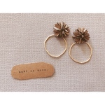 beige flower × gold ring