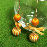【巻き玉】リボンピアス：オレンジ