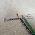 27.陶器ネコの筆置き