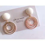 white cabochon × gold rings