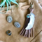 ➵ feather charm ➵