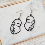 【再販】個性的な黒いお顔のピアス