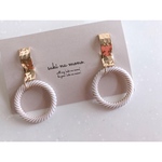 gold ribbon × antique ring pierce