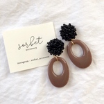 black beads flower × brown oval