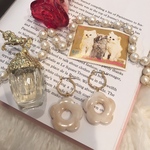 #1459 creamy beige flower pierce 