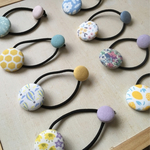 パステルカラーのくるみボタンヘアゴム