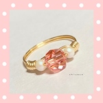 SWAROVSKIのワイヤーリング ローズピーチ