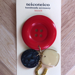 button brooch