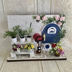 ミニチュア   薔薇のアーチのある玄関先