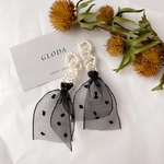 パールピアス 大ぶりピアス パールロングピアス リボン タッセル フリンジ 樹脂 イヤリング アレルギー対応 結婚式 ウェディング ブライダル お呼ばれ フォーマル ロングピアス パーティー 入学式