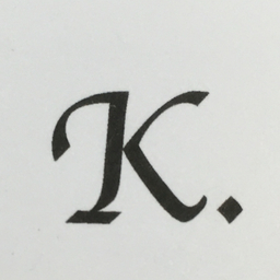 K.